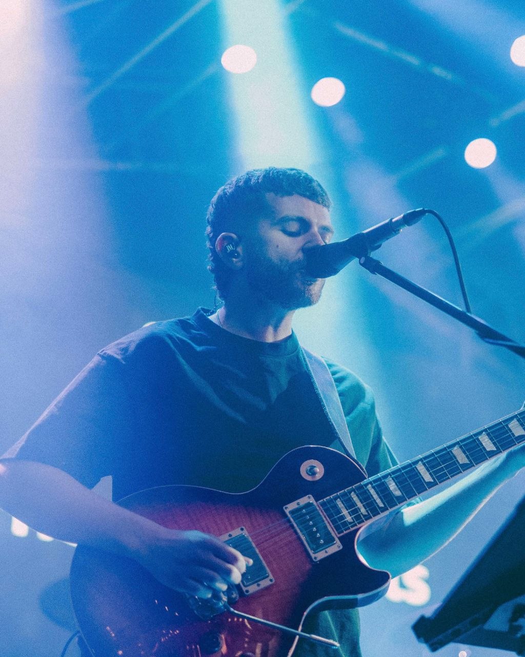 The Houndcats guitarist singing during a live performance